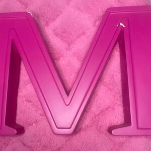 Pink letter m